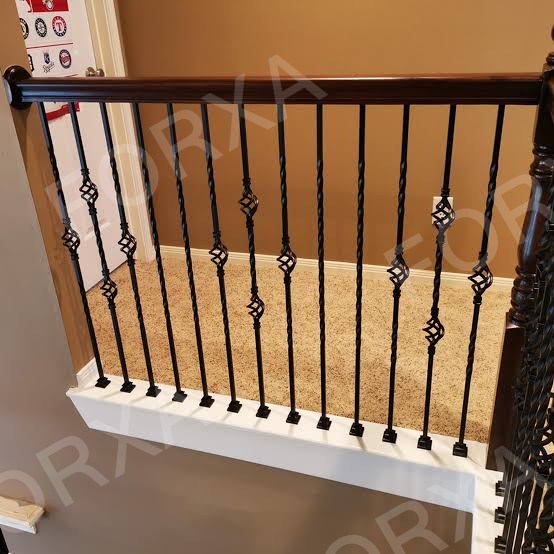 A finished staircase landing fitted with new metal spindles